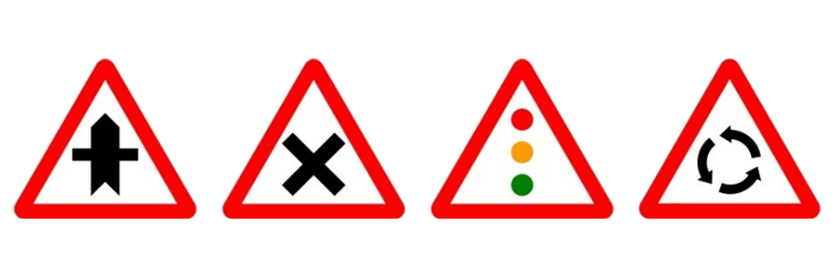 Las señales de intersección con prioridad, intersección con prioridad de la derecha, semáforos y glorieta, una junto a otra