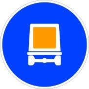 Señal: Calzada obligatoria para vehículos que transporten mercancías peligrosas: obligación para los conductores de toda clase de vehículos que transporten mercancías peligrosas y requieran estar señalizados de acuerdo con su normativa específica de circular por la calzada a cuya entrada esté situada