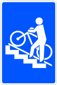 Señal: Paso superior para peatones con rail o rampa para ciclos: situación de un paso superior para peatones acondicionado con rail o rampa para ciclos